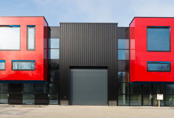 DENEKAMP, NETHERLANDS - FEBRUARY 13, 2016: newly build red industrial warehouse with offices